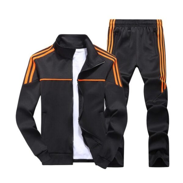 A black track suit with orange stripes on the sleeves and pants view showing premium detailing – Qintaar